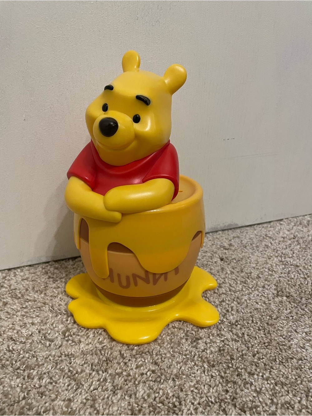 Disney Winnie the Pooh Yellow and Red Sitting in Honey Pot Toy